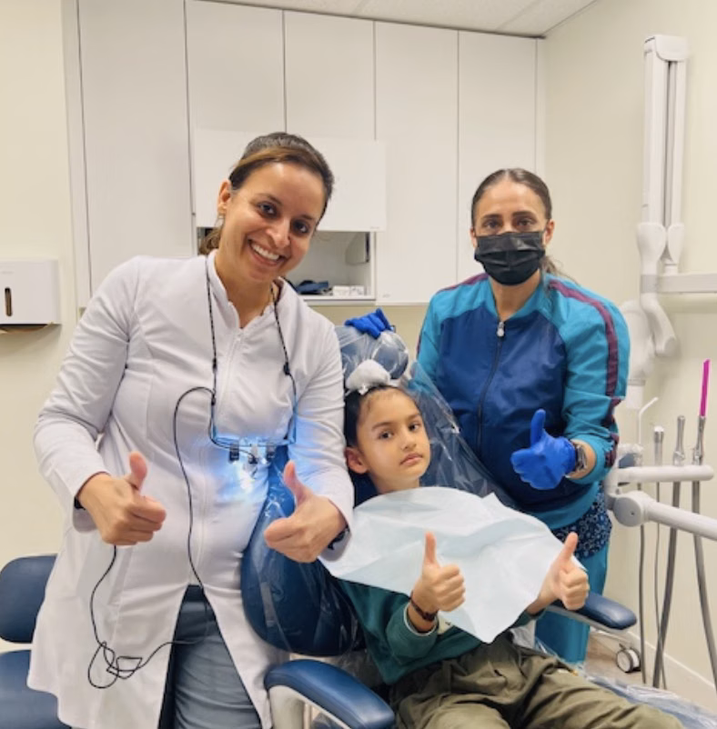 Saravpreet Kaur with the Dazzle Dental team